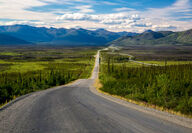 Mountains backdrop the Dalton Highway and parallel trans-Alaska oil pipeline.