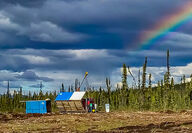Rainbow shines down over Banyan Gold's AurMac camp in Yukon, Canada.