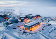 Aerial view of a large Canadian Arctic mining complex during the winter.