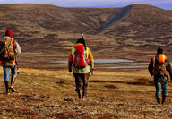 Workers backpack across Pebble copper gold mine project Alaska