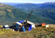 A drill tests for gold-silver mineralization on a mountain saddle at Homestake.