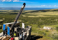 A drill rig tests Graphite Creek during a warm summer day in Alaska.