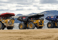 Canada, Tahltan Nation, and Australia flag trucks at mine in Northern BC.