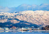 Massive wind turbines on a mountain on Kodiak Island, Alaska.
