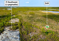 The outcropping Southwest Fi pegmatite dyke dwarfs the drill testing it.