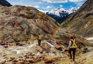 Workers traverse a highly mineralized rock outcrop at the KSM Mine project.