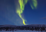 A streak of bright green northern lights over a Yukon gold exploration project.