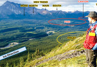 Geologist looks across wide valley to copper-gold exploration targets at Joy.