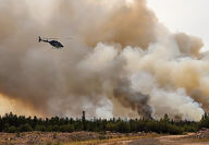 Helicopters deliver water to battle wildfires near Yellowknife.