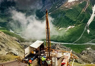 Looking down on a drill set up on a mountainside at the Palmer mine project.