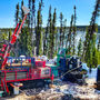 A driller tests for gold as the snow melts on a spring day in Alaska.
