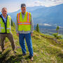 Mining executive and Alaska governor on a ridge overlooking the Skwentna River.