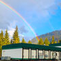 A rainbow shines down over the Palmer project camp in Alaska.