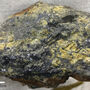 A large chunk of galena or lead, with crystalline sphalerite or zinc on it.