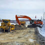 Cat dozer and Hitachi excavator work on the Tetlin Road.