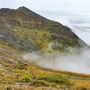 Drill on mountain ridge above the clouds, tests the Arctic Mine deposit in AK.