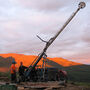 A drill rig backset by a gorgeous sunset in Yukon, Canada.