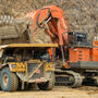 Excavator loading ore into haul truck at Kinross Alaska’s Fort Knox gold mine.