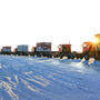 Convoy of trucks cross frozen landscape on its way to eastern Russia gold mine.
