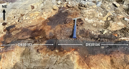Limestone stained from massive sulfide silver-zinc-lead-copper mineralization.