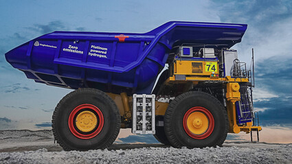 Large mining truck with “zero emissions platinum powered hydrogen” on bed.