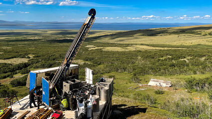 A drill rig tests Graphite Creek during a warm summer day in Alaska.