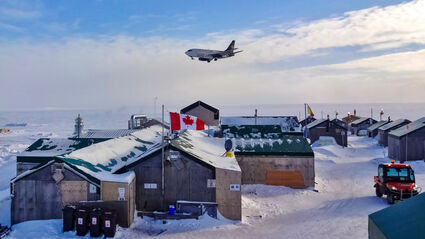 A large plane lands during the winter at a gold exploration camp in Nunavut.