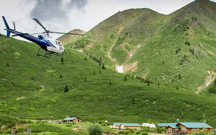 A helicopter flying into ATAC Resources' Rackla Gold property camp.