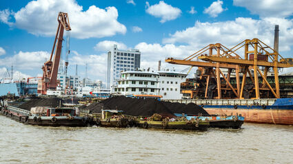 Rare earth elements critical minerals ship loading China, US reliance on imports