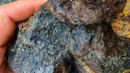 High-grade sample with blue and gold-colored copper-silver-zinc minerals.