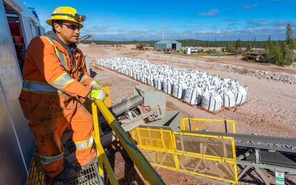 A Nechalacho ore sorter operator looks over bags of rare earths concentrates.