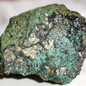 Highly mineralized sample with gold chalcopyrite and green copper oxidation.