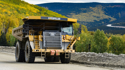 A Cat mining haul truck travels between the Gil gold deposit and Fort Knox mill.