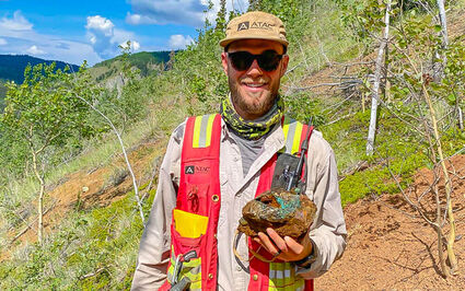 VP Exploration Adam Coulter holds chunk of copper-rich rock from Catch.
