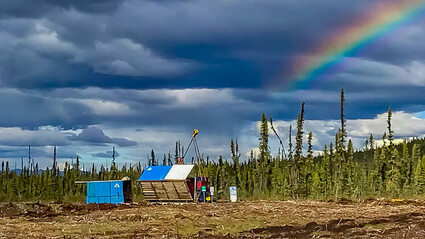 Rainbow shines down over Banyan Gold's AurMac camp in Yukon, Canada.