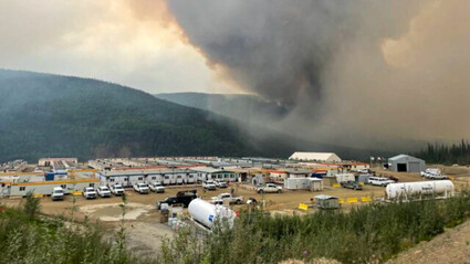 A huge plume of black smoke above the Eagle Gold mine camp in Canada’s Yukon.