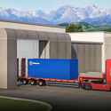 Rendering of an eVinci reactor containor being transported by truck.