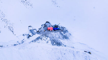 A drill pad on the side of a snowy mountain at Sitka Gold's RC Gold project.