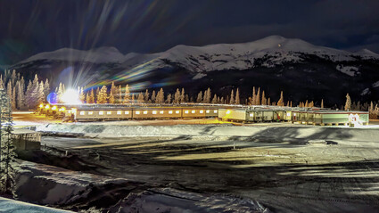 Modular exploration camp shines brightly on a winter night in British Columbia.