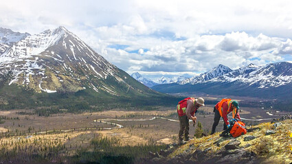 Geologists inspecting geology on slope at Fireweed’s Macmillan Pass project.