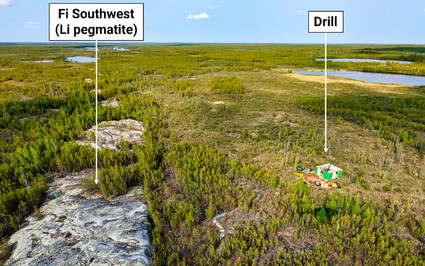The outcropping Southwest Fi pegmatite dyke dwarfs the drill testing it.