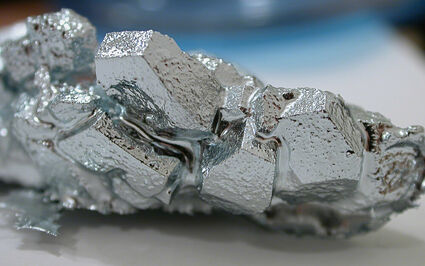 Gallium in its crystal form at below 86 degrees Fahrenheit.
