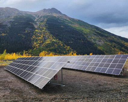 A new solar array in front of hill with golden fall foliage in BC.