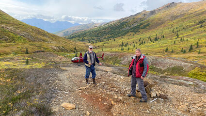 Geologists explore highly mineralized rock at Sun VMS project in Northwest AK.