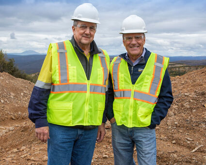 The presidents of Barrick Gold and Novagold in hardhats and safety vests.