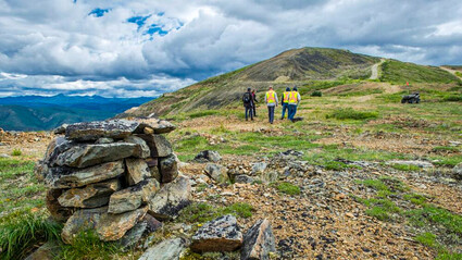 Western Copper and Gold geologists walking up a slope.