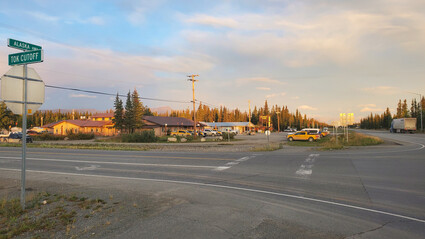 The rising sun shines on the buildings at the Manh Choh gold mine camp.
