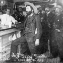 Outlaw Soapy Smith having a drink at his saloon in Skagway, Alaska.