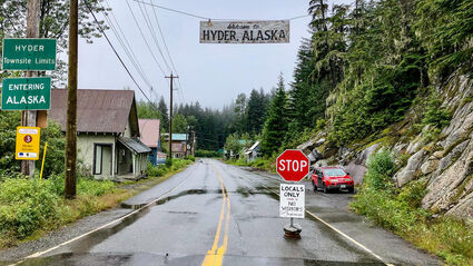 Welcome to Hyder Alaska sign above the road crossing into Alaska from BC.
