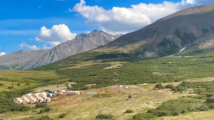 A summer Quonset tent camp set up at the foot of the Kigluaik Mountains, Alaska.